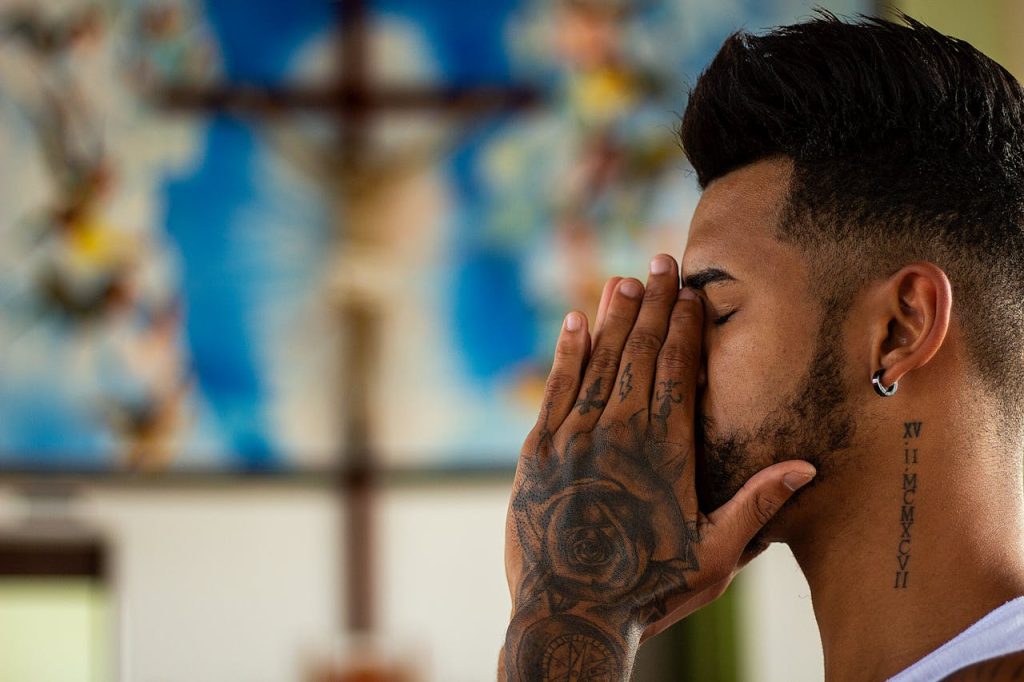 Closed Eyed Man Holding His Face Using Both of His Hands